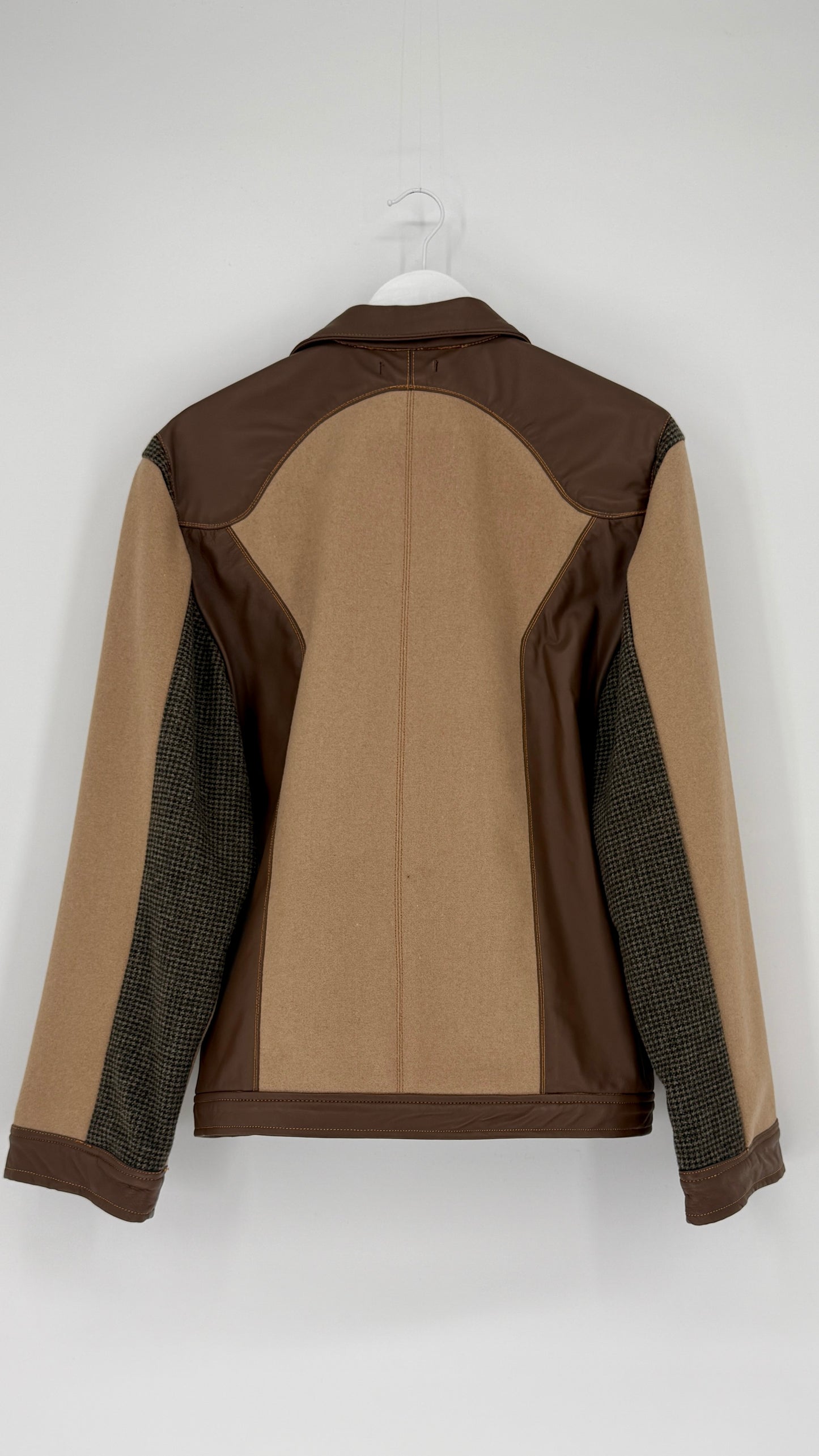 Brown and beige jacket on a white hanger against a white background