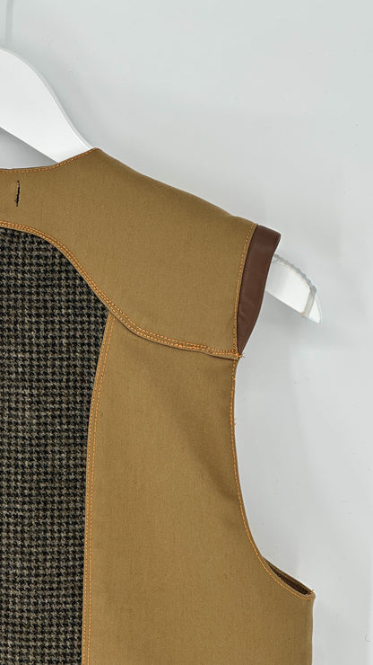 Brown vest with a textured back on a white hanger