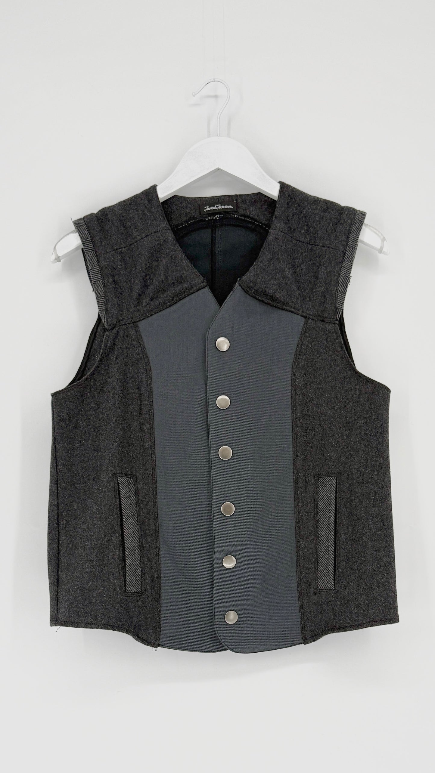 Gray vest with button details on a white background