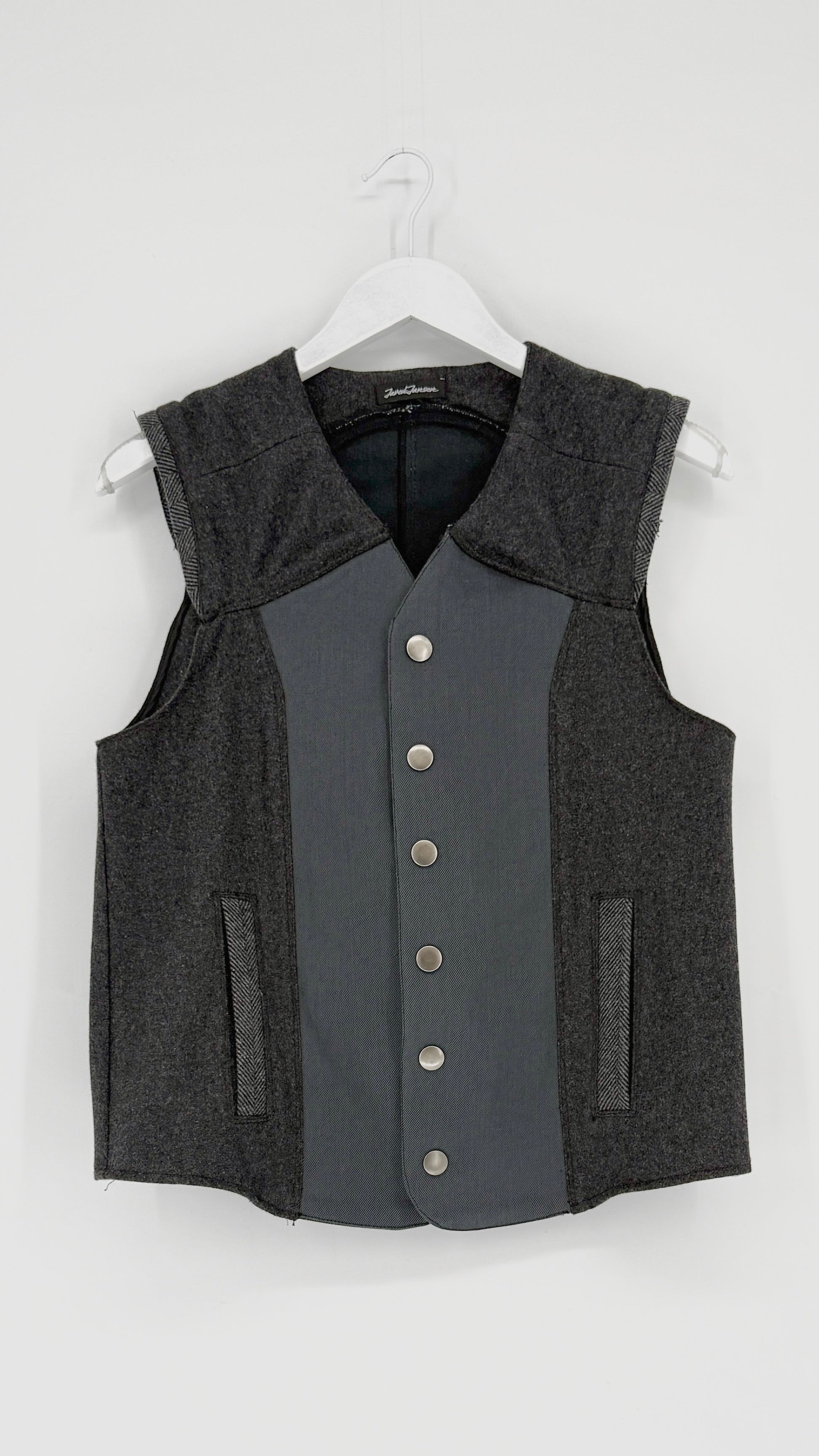 Gray vest with button details on a white background