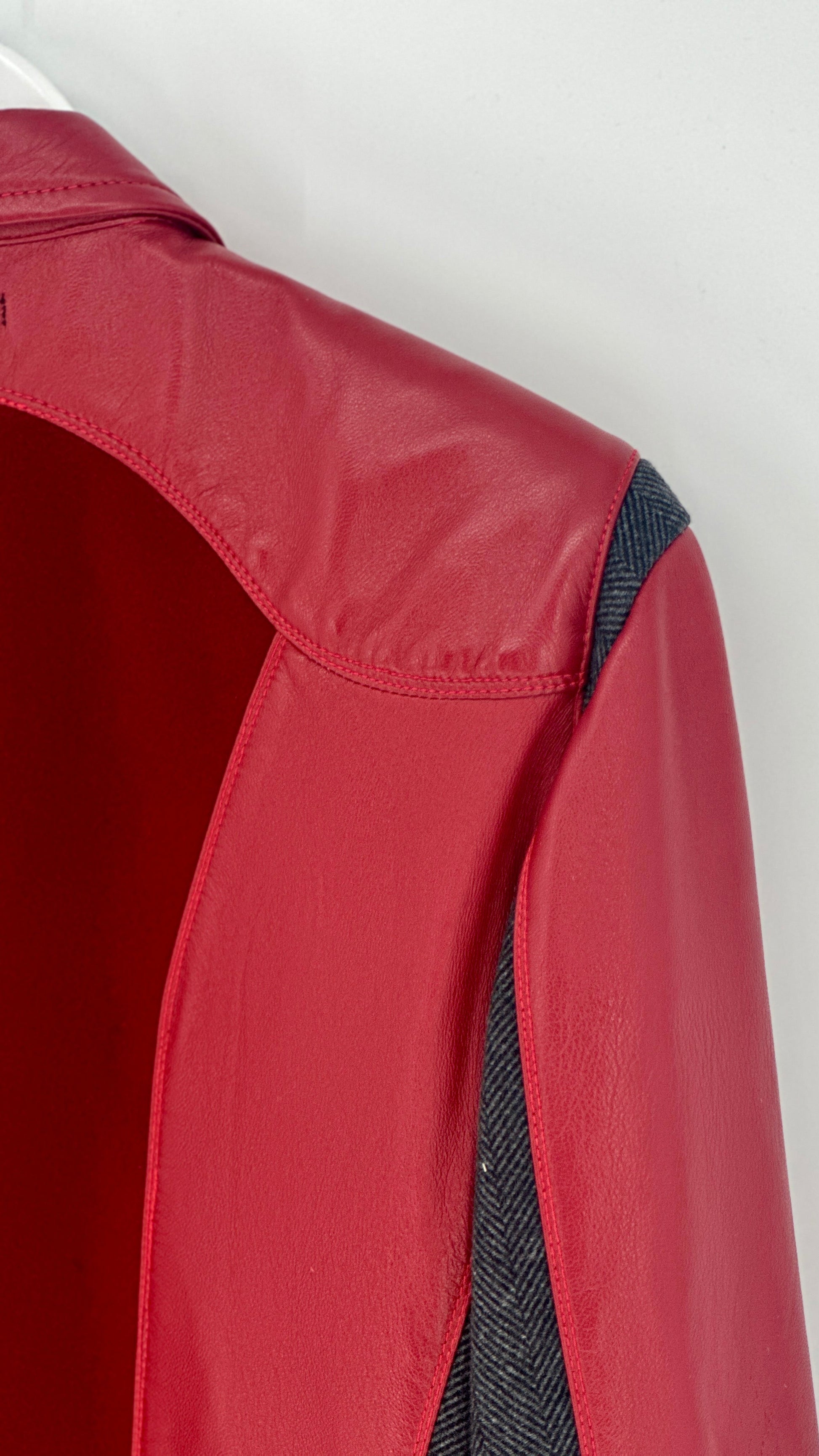Red jacket with black lining on a white background