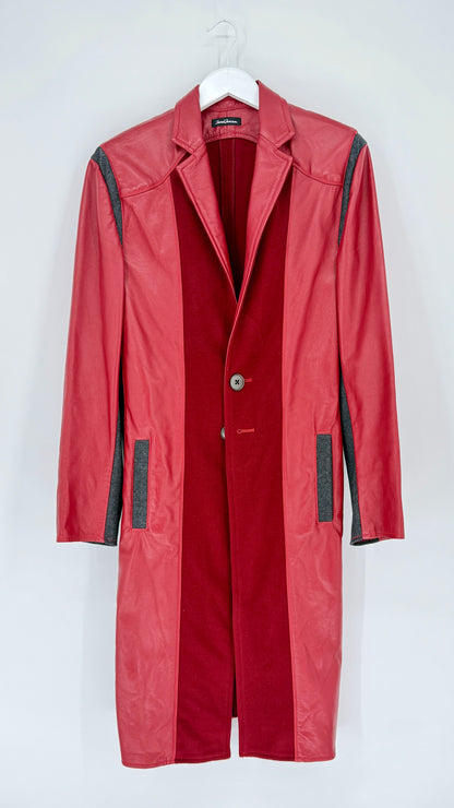 Red coat with black accents on a white hanger against a white background