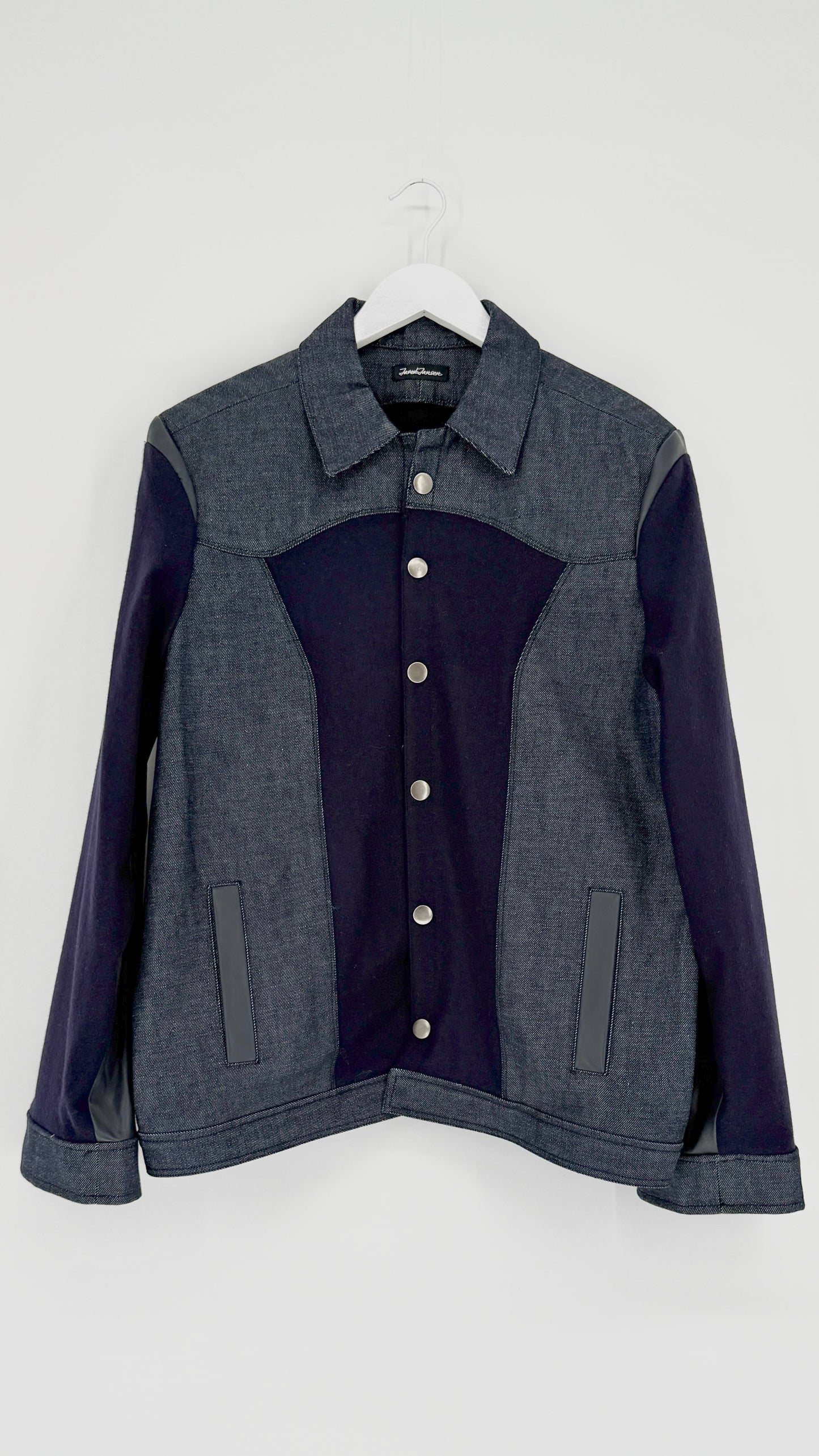Two-tone jacket with dark blue and gray sections on a white background