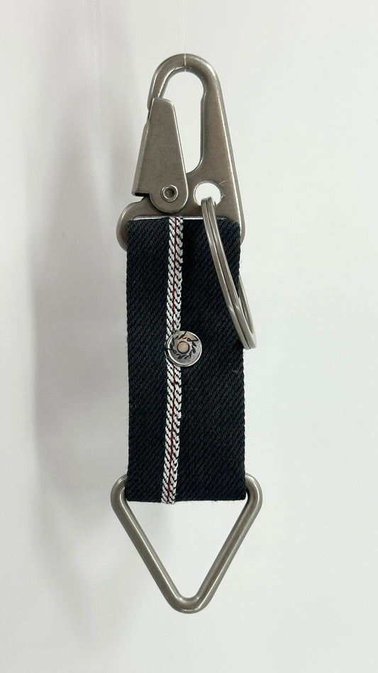 Keychain with black strap and metal clip on a white background